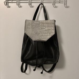 Danielle Nicole black backpack with snakeskin top